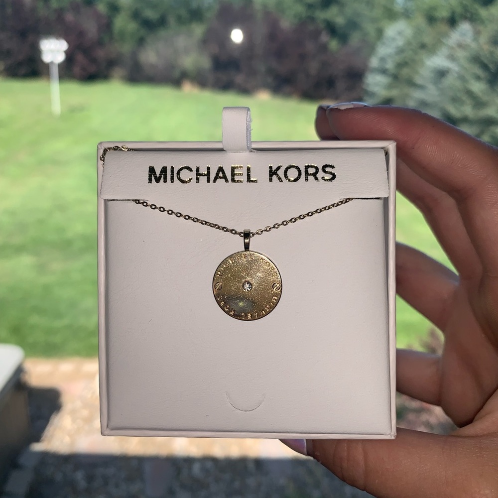 Gold circular Michael Kors Necklace!